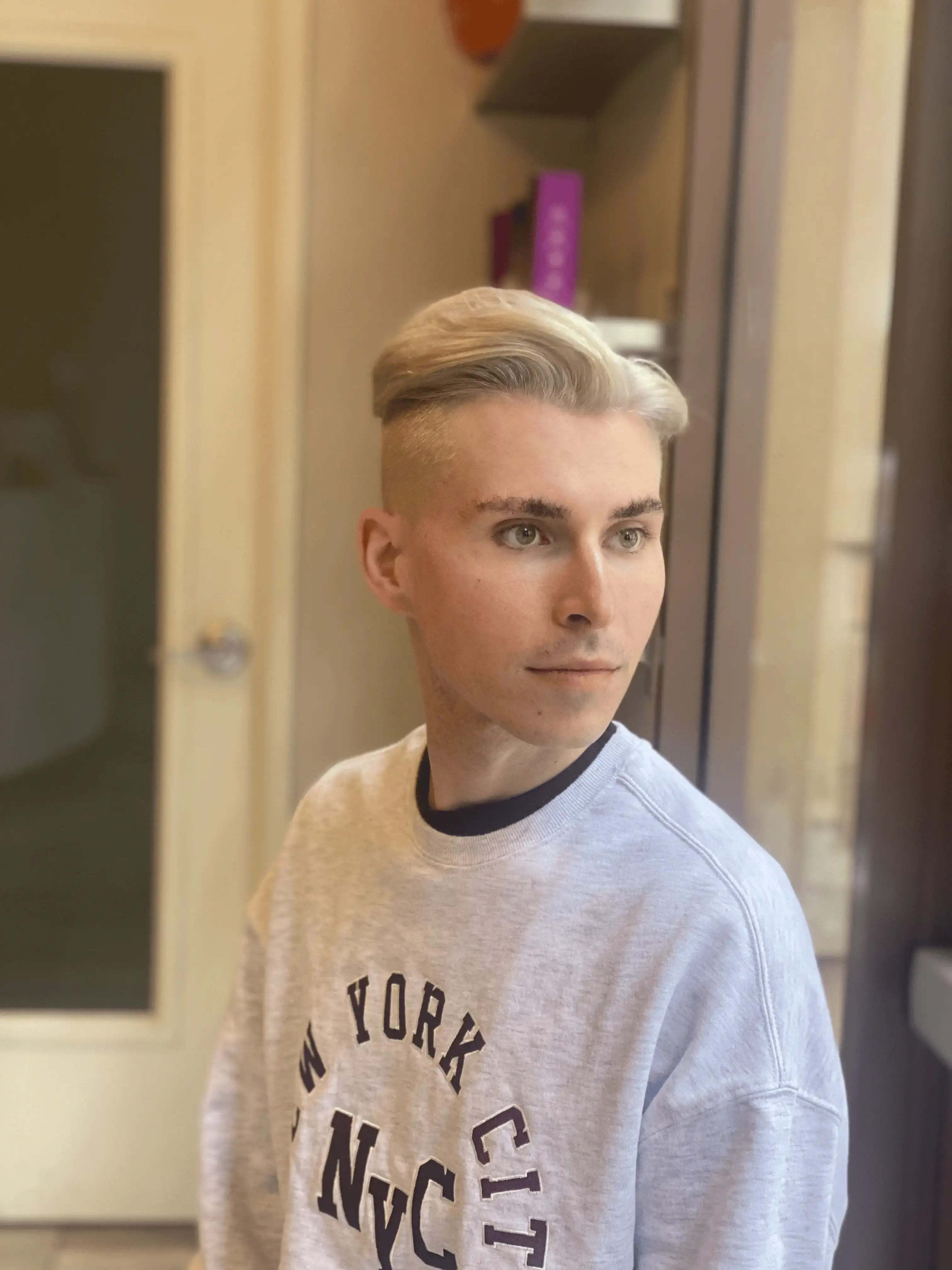 A vibrant, modern men's bleach and tone hairstyle