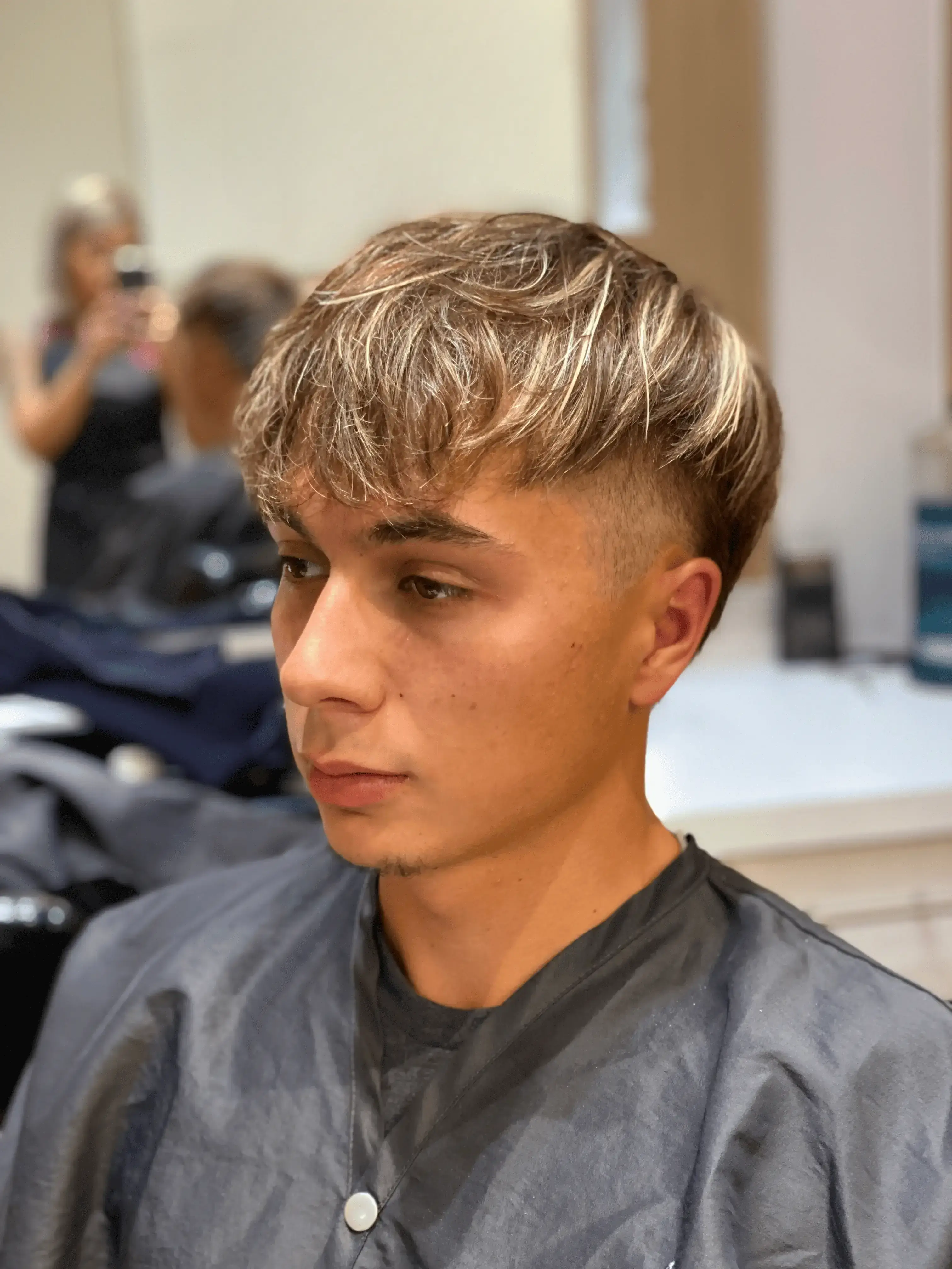 Men's hair with professional full and partial highlights for added dimension