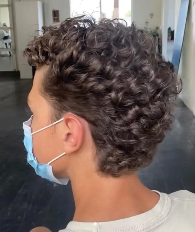 Example of a men's full head perm creating a thick, curly hairstyle
